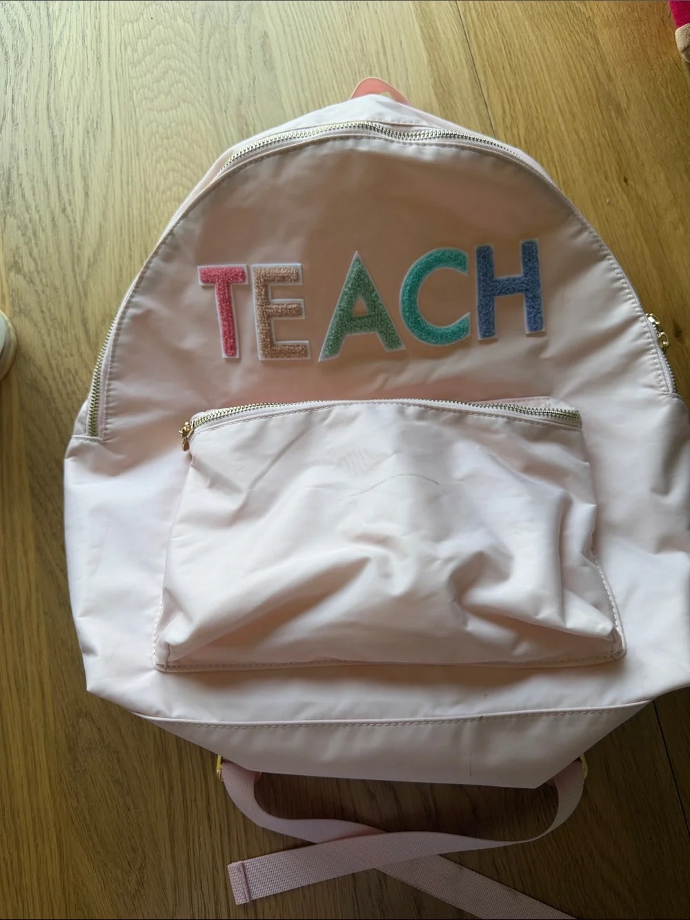 Pink Backpack with Colorful 'TEACH' Letters